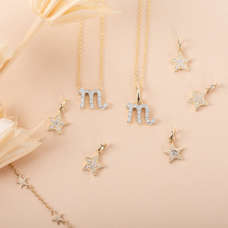 14k Gold Star with Tiny Diamond Pendant